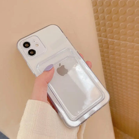 a woman holding a clear phone case