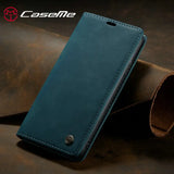 a close up of a blue caseme wallet case on a table