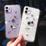 a pair of iphone cases with cartoon characters on them