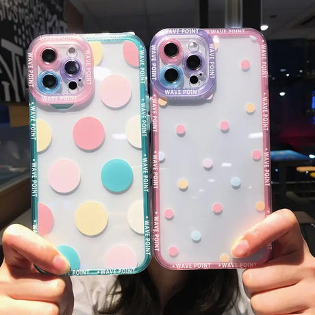 two girls holding up their iphone cases