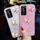 two cases with glitter butterflies on them