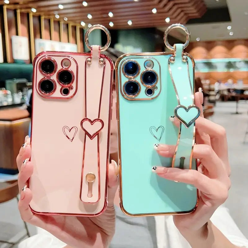 two cases with heart charms on them