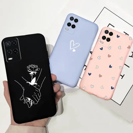 a hand holding a phone case with a heart pattern