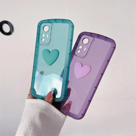 a person holding a phone case with a heart on it