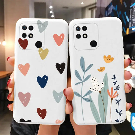 two cases with hearts and flowers on them