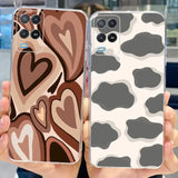 a woman holding up a phone case with a cow print