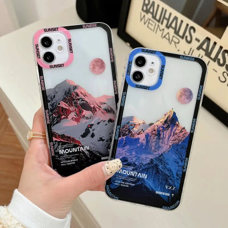 two cases with mountains and mountains on them