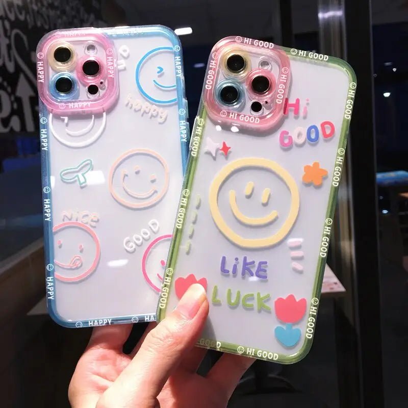 a pair of phone cases with smiley faces on them