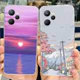 two cases with a sunset scene on them