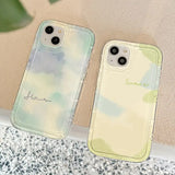 two cases with a watercolor painting on them