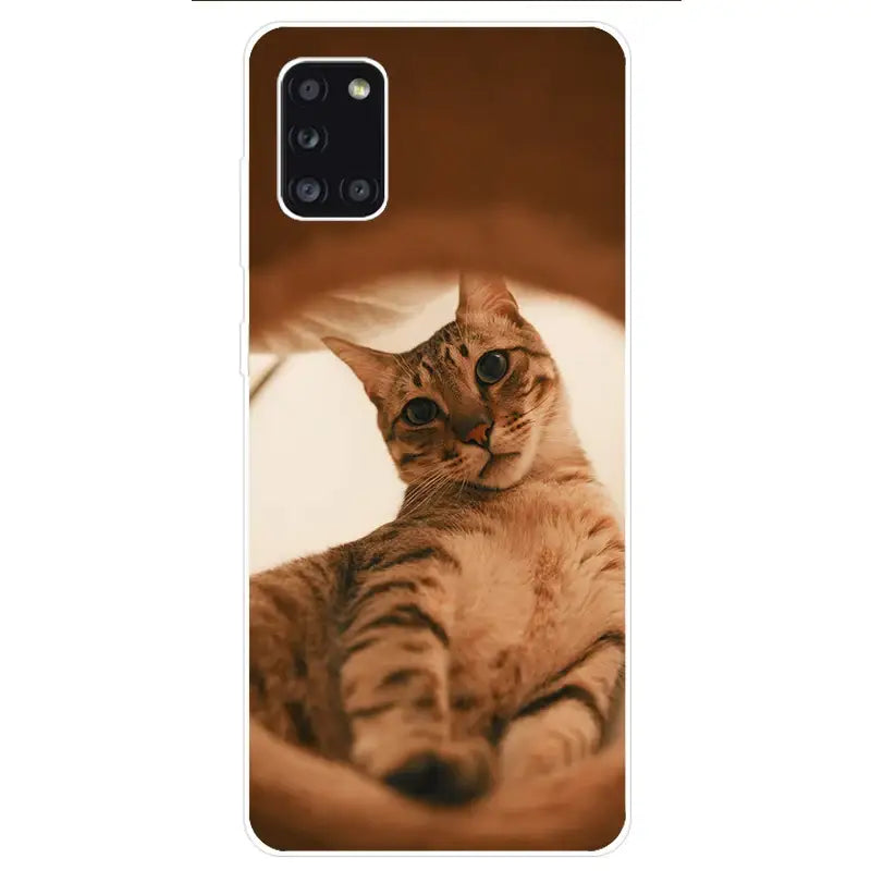 a cat is laying on the floor phone case