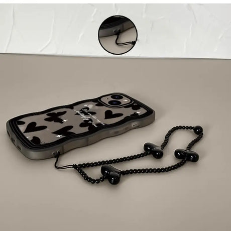 a cell phone with a chain attached to it