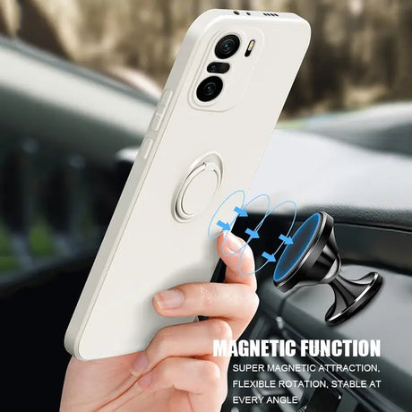 someone holding a cell phone in their hand with a magnet on it