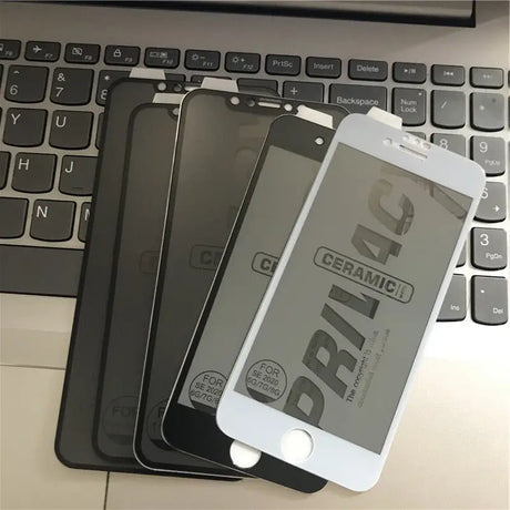 a cell phone and a keyboard on a desk