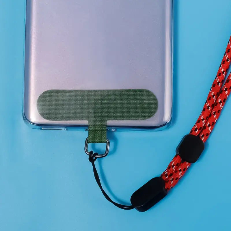 there is a cell phone with a lanyard attached to it