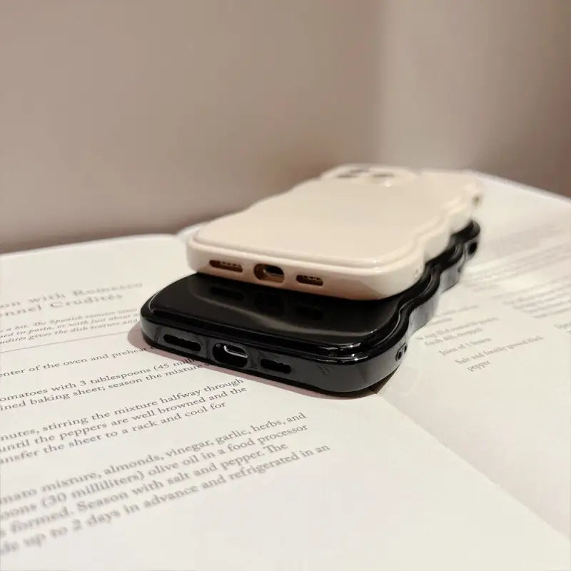 a cell phone sitting on top of a book