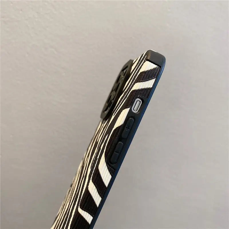 a pen with a black and white stripe pattern on it