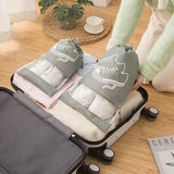 a woman is pulling a suitcase with two baby clothes