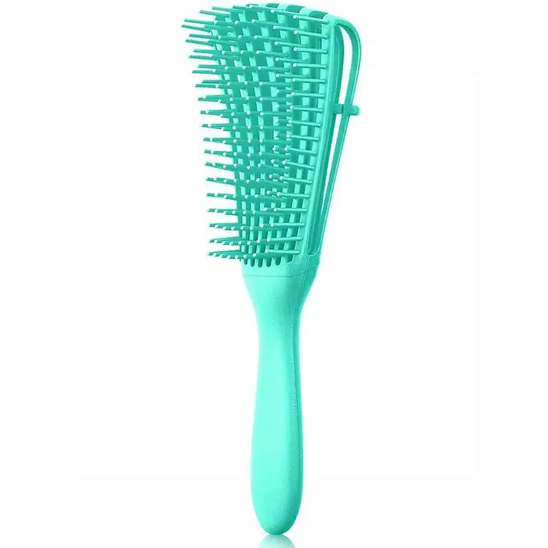 a close up of a green hair brush with a handle