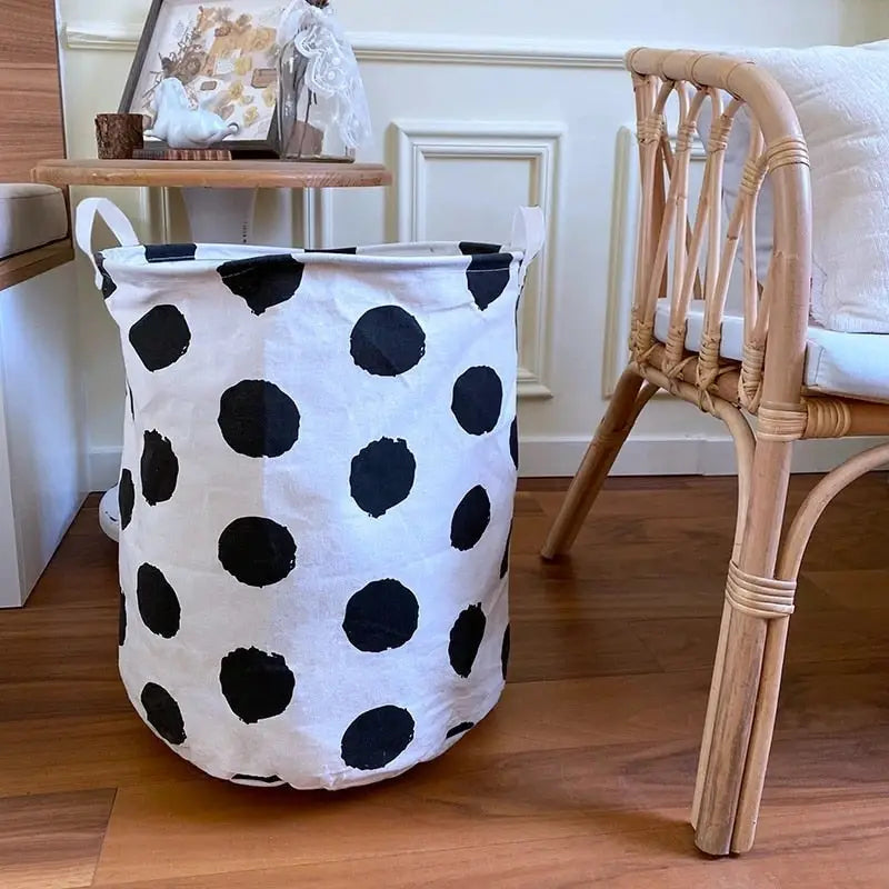 a chair and a cow print laundry basket