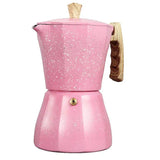 a pink stove with a wooden handle and a gold handle