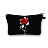 a black cosmetic bag with a red rose on it