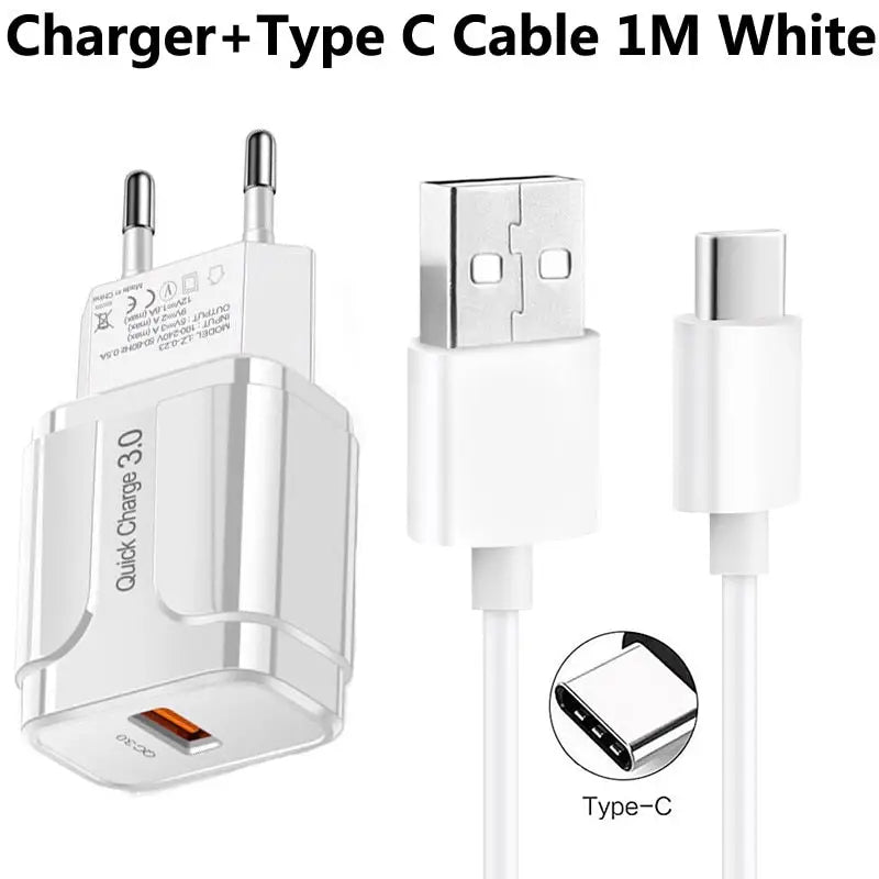 a close up of a white charger and cable connected to a white phone
