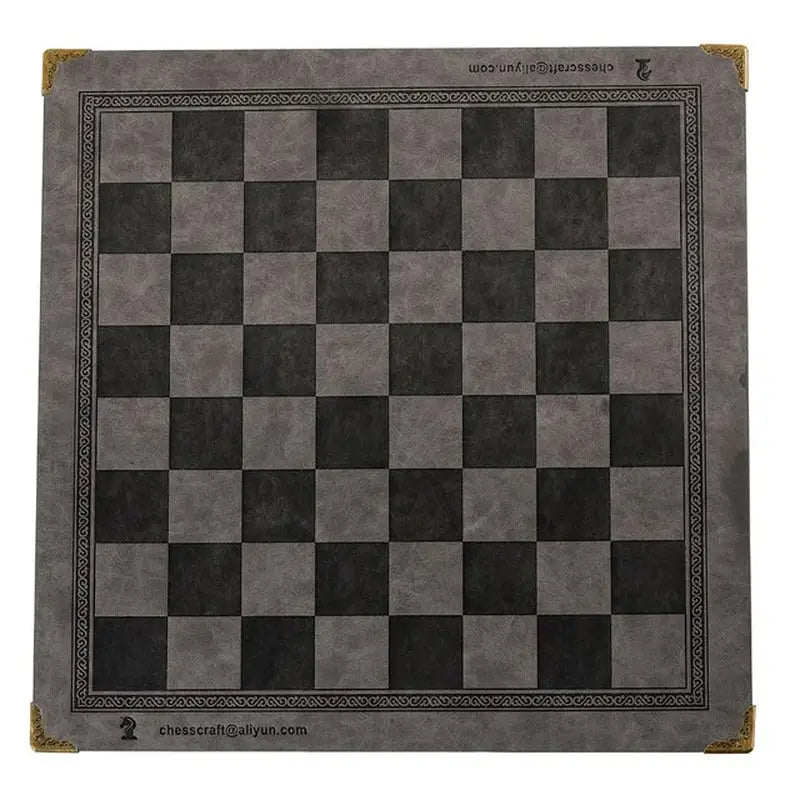 a black and white chess board with a gold border