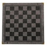 a black and white chess board with a gold border