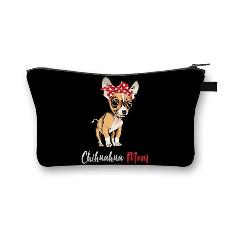 a small black purse with a dog wearing a red bow