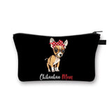 a small black purse with a dog wearing a red bow