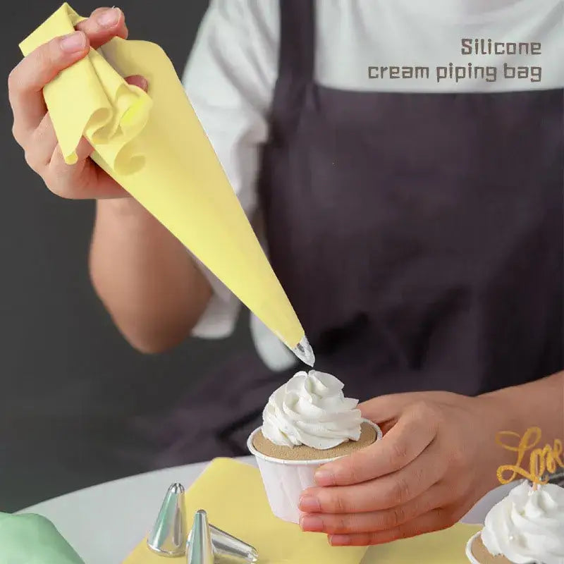 a child is making cupcakes with a paper cone