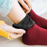 a child’s feet with a pair of socks