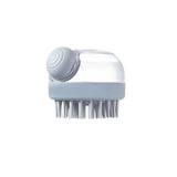 a white brush with a plastic container on top