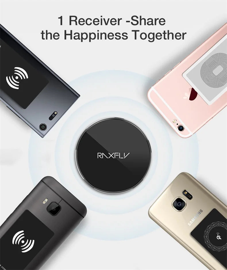 Circular black wireless charging device surrounded by four smartphones.