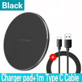 Circular black wireless charging pad with accompanying USB cable.