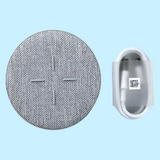 Circular gray fabric speaker cover or grille with a cross pattern in the center.