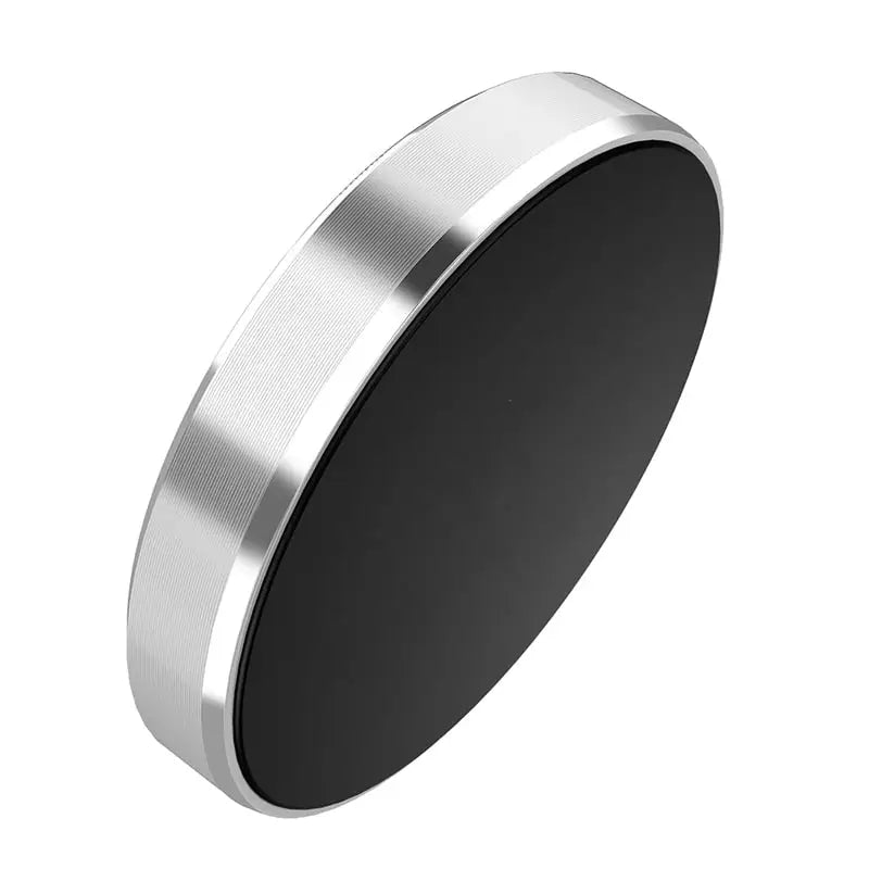 a circular metal object with a black surface