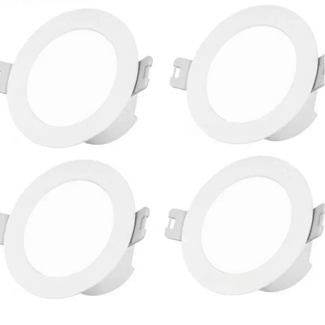 Circular white recessed light fixtures with mounting brackets.