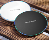 Circular wireless fast chargers, one white and one black, with glowing blue edges.