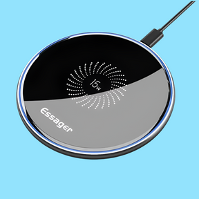 Circular wireless charging pad with a black and gray design featuring a spiral pattern.