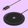 Circular wireless charging pad with a lightning bolt logo and perforated design.