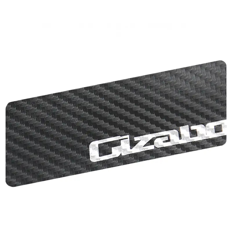 a close up of a carbon carbon plate with the word gzaal on it