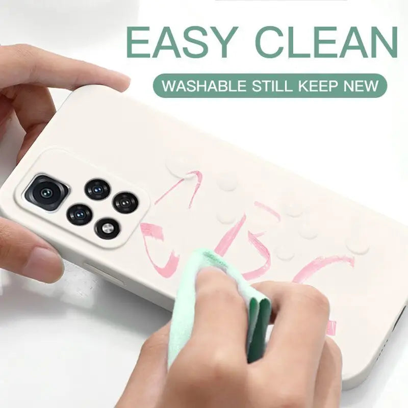 a person using a green marker to paint on a phone