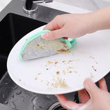 someone cleaning a plate with a sponge