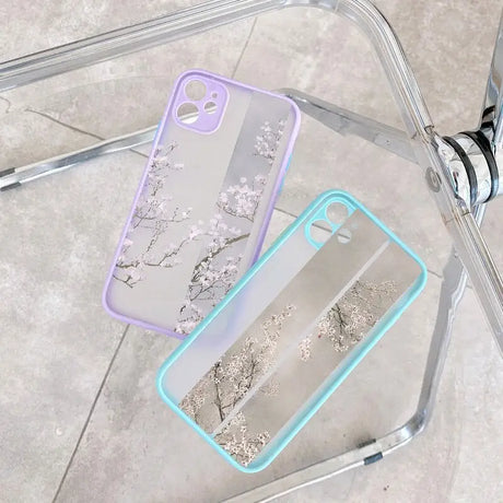 a clear case with a silver and blue flower design