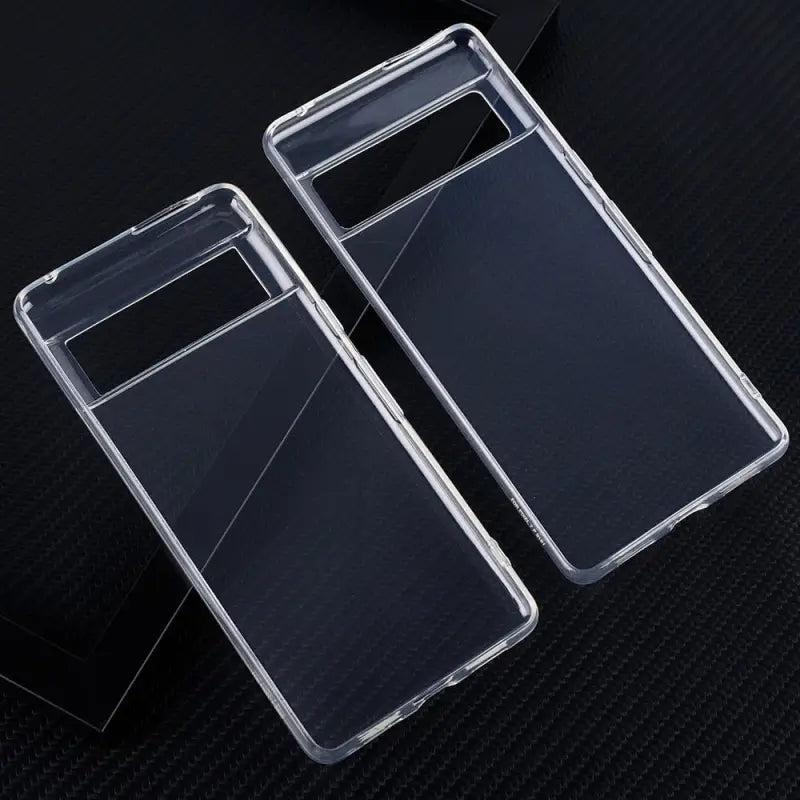 a pair of clear cases on a black surface