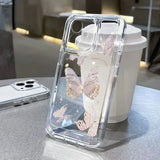 a clear case with a pink flower design on it