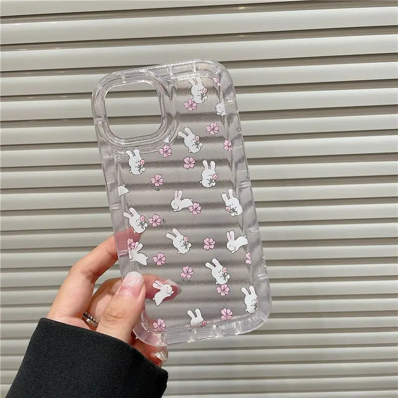 a clear case with pink flowers and bunny ears on it