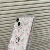 a clear case with white and pink flowers on it